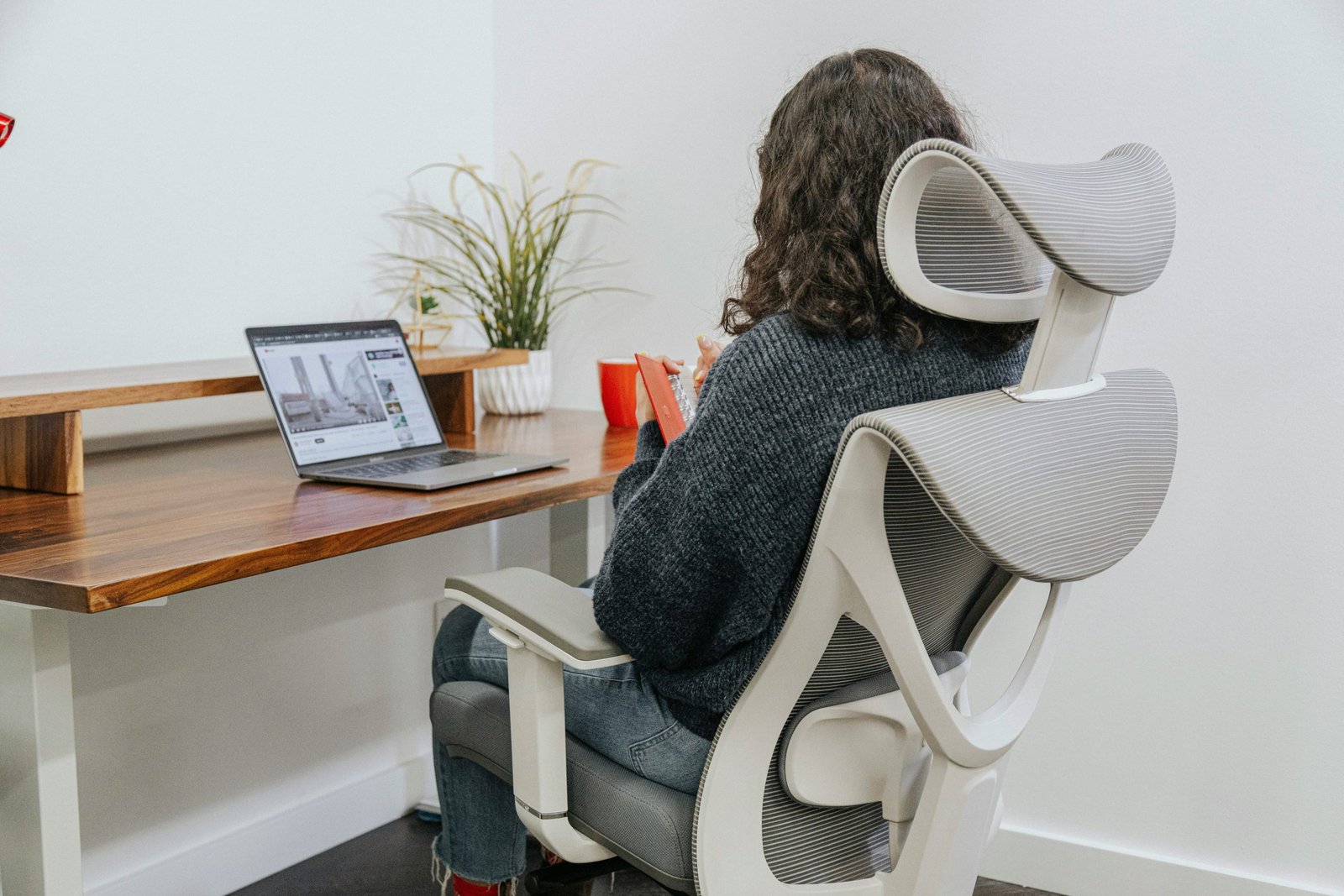 woman sitting on an ergonomic office chair