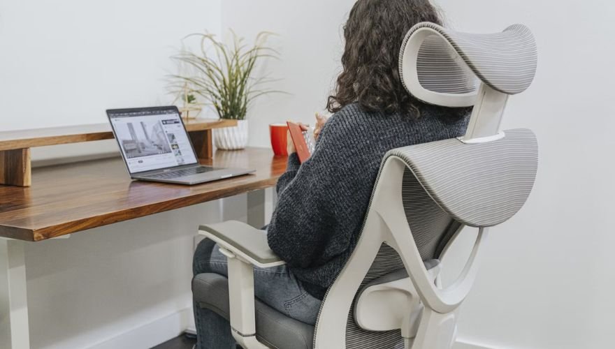 A woman sitting in an ergonomic chair